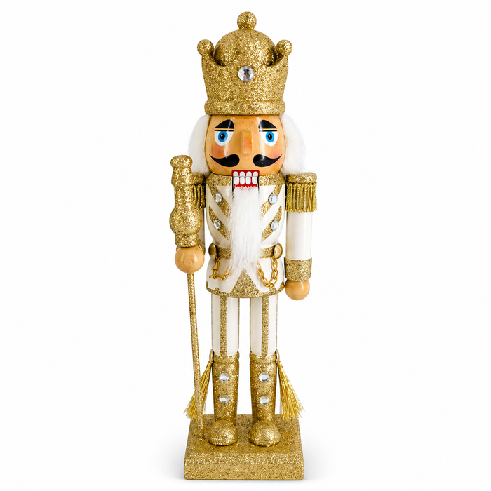 King nutcracker figure in gold and ivory, with jeweled crown and glitter scepter