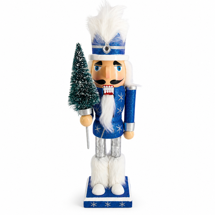 Snow Fantasy king nutcracker figure in blue glitter and silver, holding a bottle brush tree