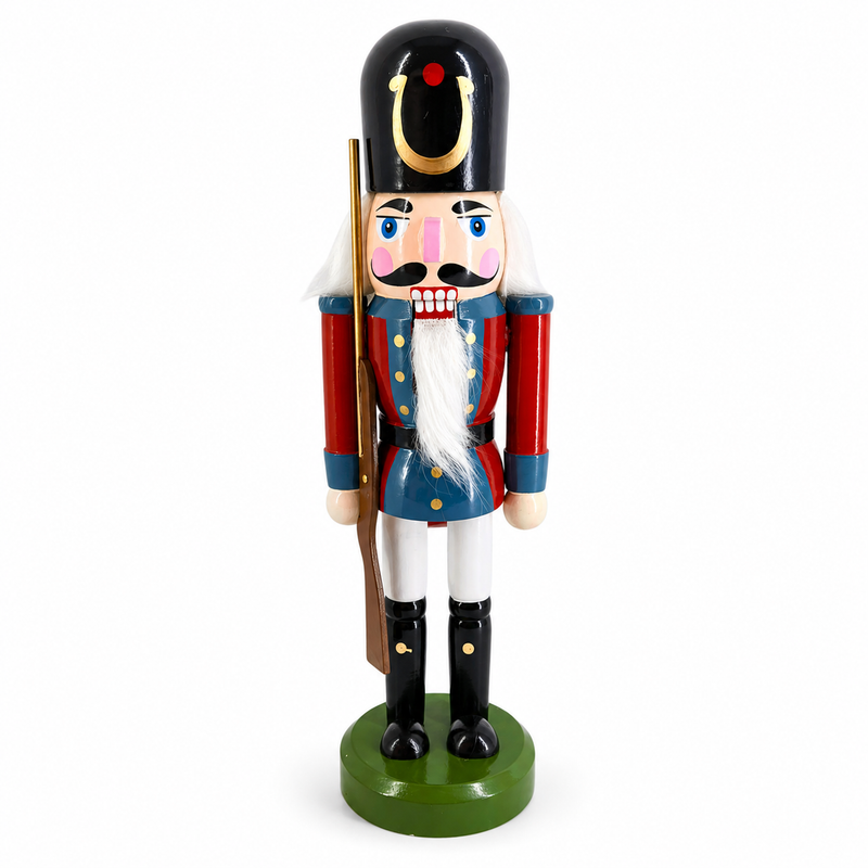 Classic toy soldier nutcracker figure in blue and red, holding a wooden rifle