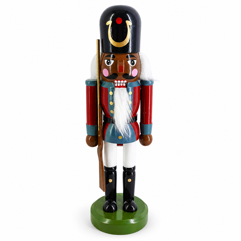 African American classic toy soldier nutcracker figure in blue and red, holding a wooden rifle