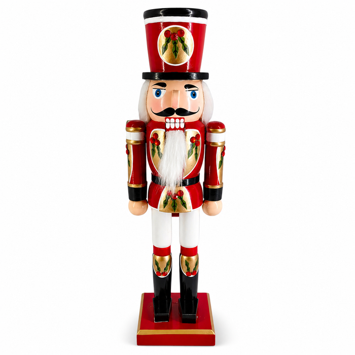 Holly nutcracker in red and gold, with holly detail on hat and jacket