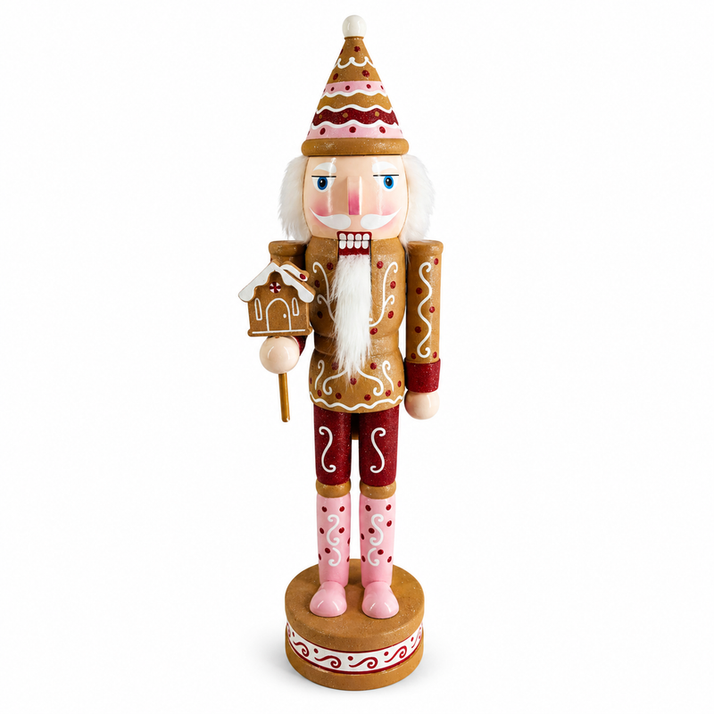 Gingerbread man nutcracker figure in tan and pink, standing on a cream-filled cookie sandwich base